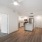 open living area connected to the kitchen and easy accessibility surrounding a kitchen island
