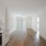open living area with spacious area for seating over wooden floors and connected to the kitchen