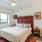 spacious bedroom with large, open spaces