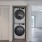 stacked washer and dryer with easy access to living room