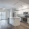 living room with large open spaces and excellent lighting from large window/patio doors