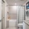 bathroom area with a sink and a stylish faucet large tub