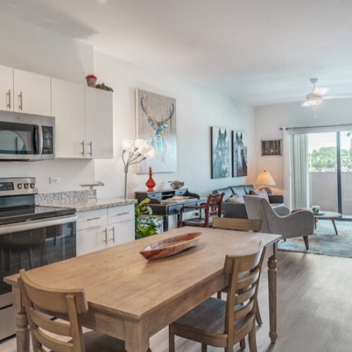 Open Concept Living spacious kitchen and living room with easy access to other rooms and on wood-style flooring