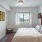spacious bedroom with large, open spaces